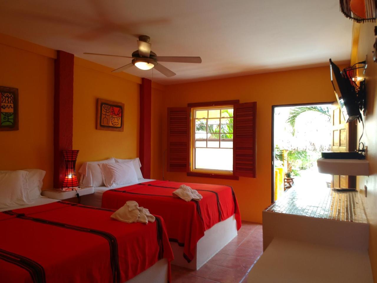 Seaside Cabanas Hotel Caye Corker Exterior photo